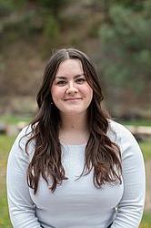 young woman in front of green background